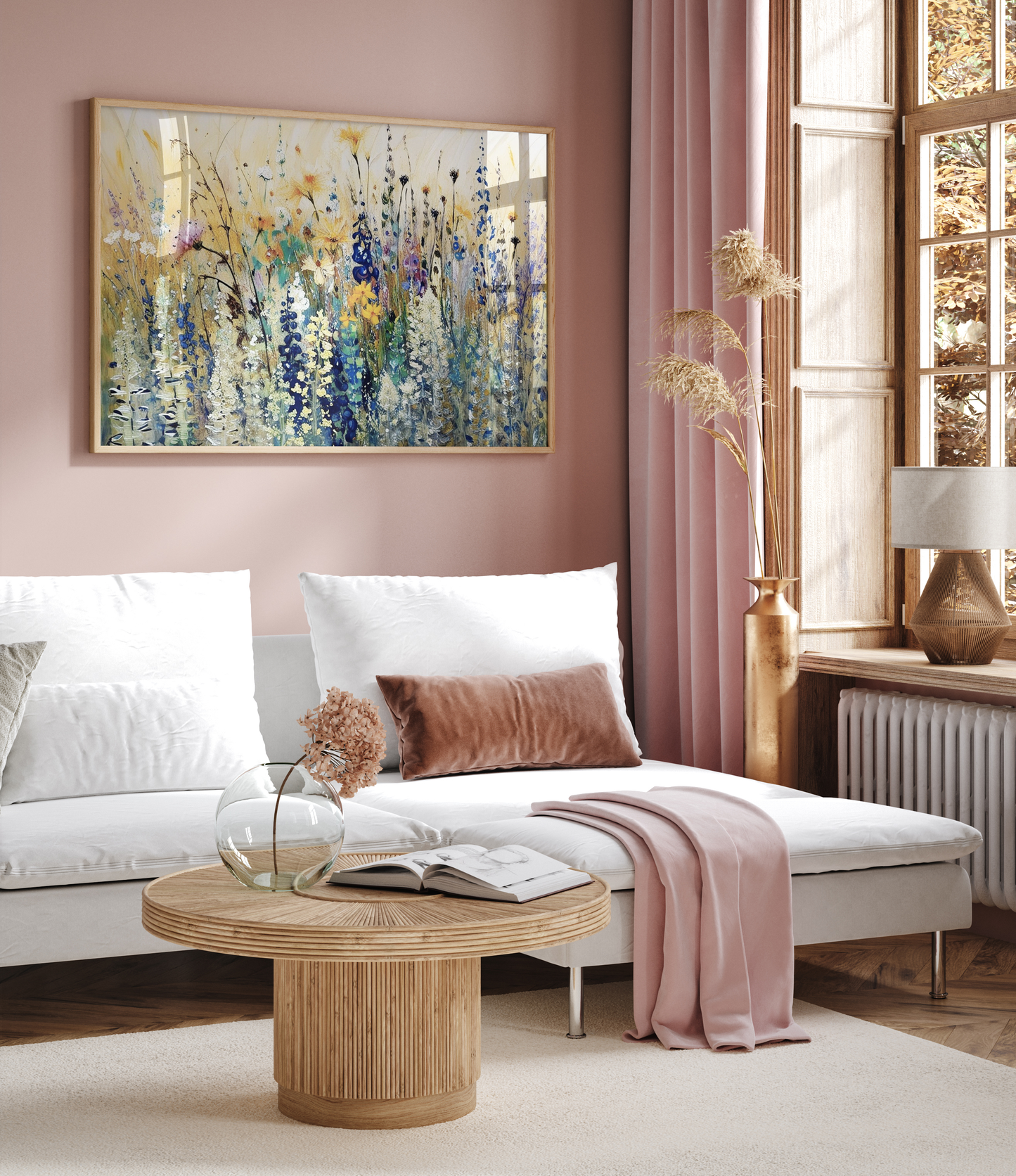 Living room with a white sofa, wooden coffee table, and wildflower abstract framed wall art on a pink wall.