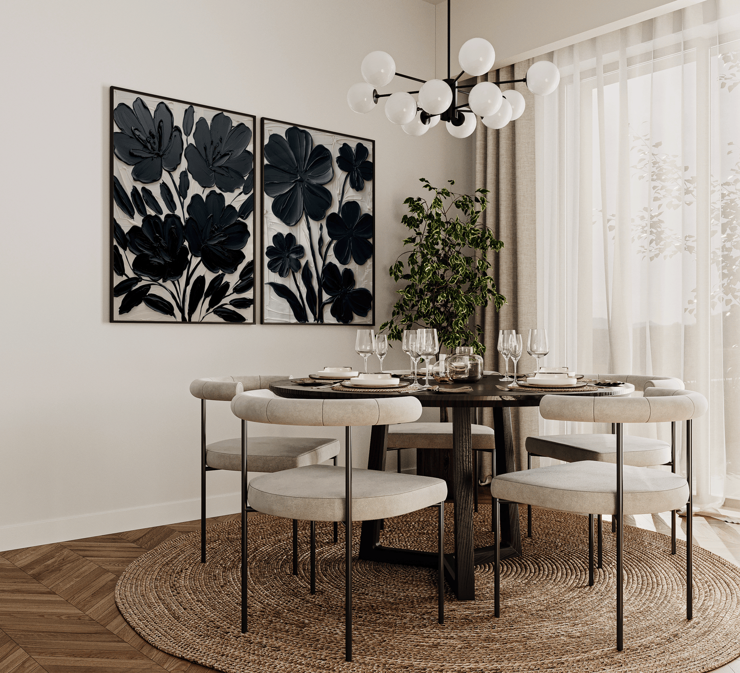 Set of two black abstract floral wall art prints framed in a modern dining room with round table, neutral chairs, and contemporary chandelier