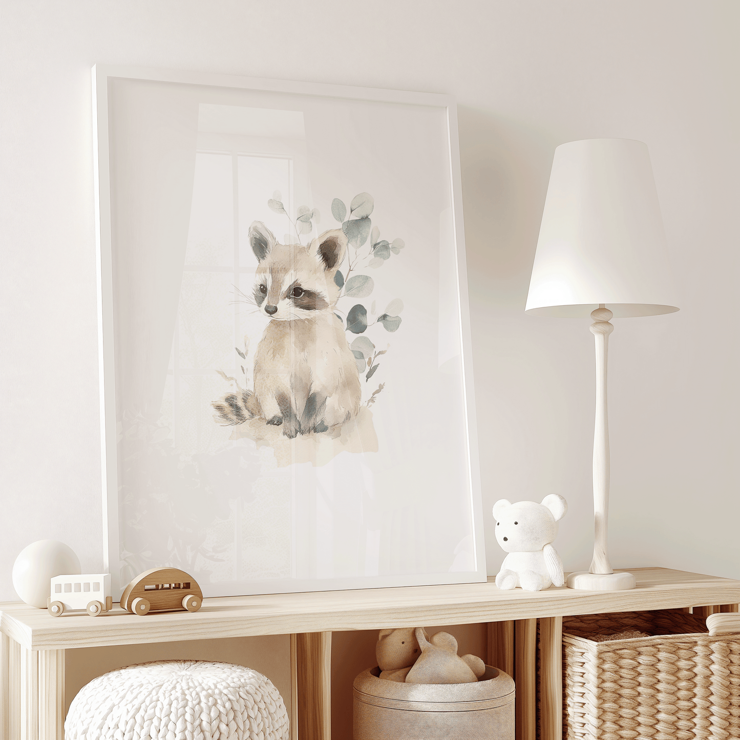 Framed raccoon wall art in a children's playroom with toy baskets and neutral tones