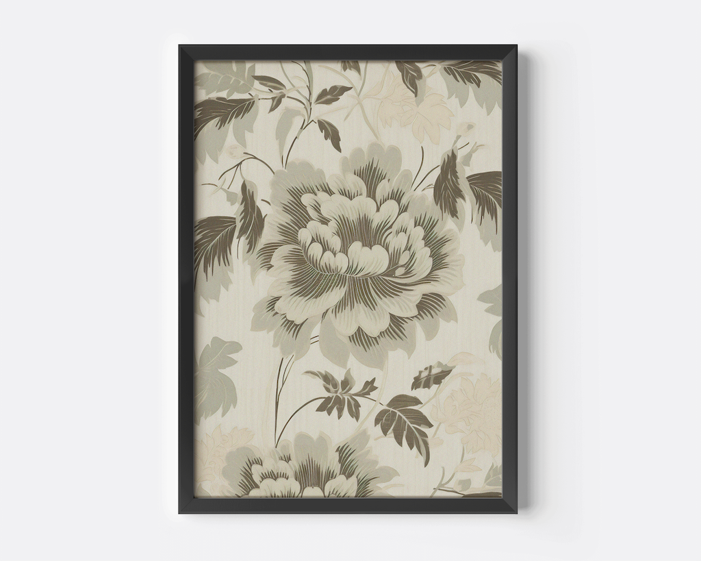 close-up of a black-framed vintage floral pattern wall art on a beige background