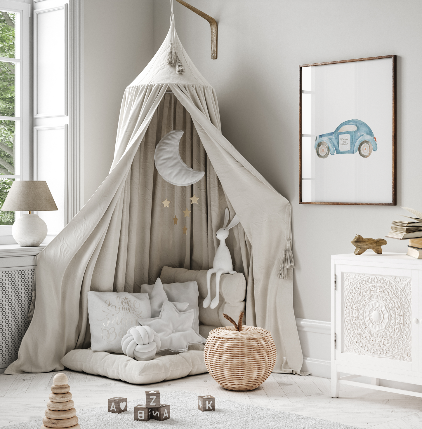 Blue car nursery wall art print with the words ‘Little racer big dreams,’ styled above a beige canopy tent reading nook with pillows, toys, and neutral decor. Perfect framed or canvas wall art for boys’ nurseries, bedrooms, and playrooms.