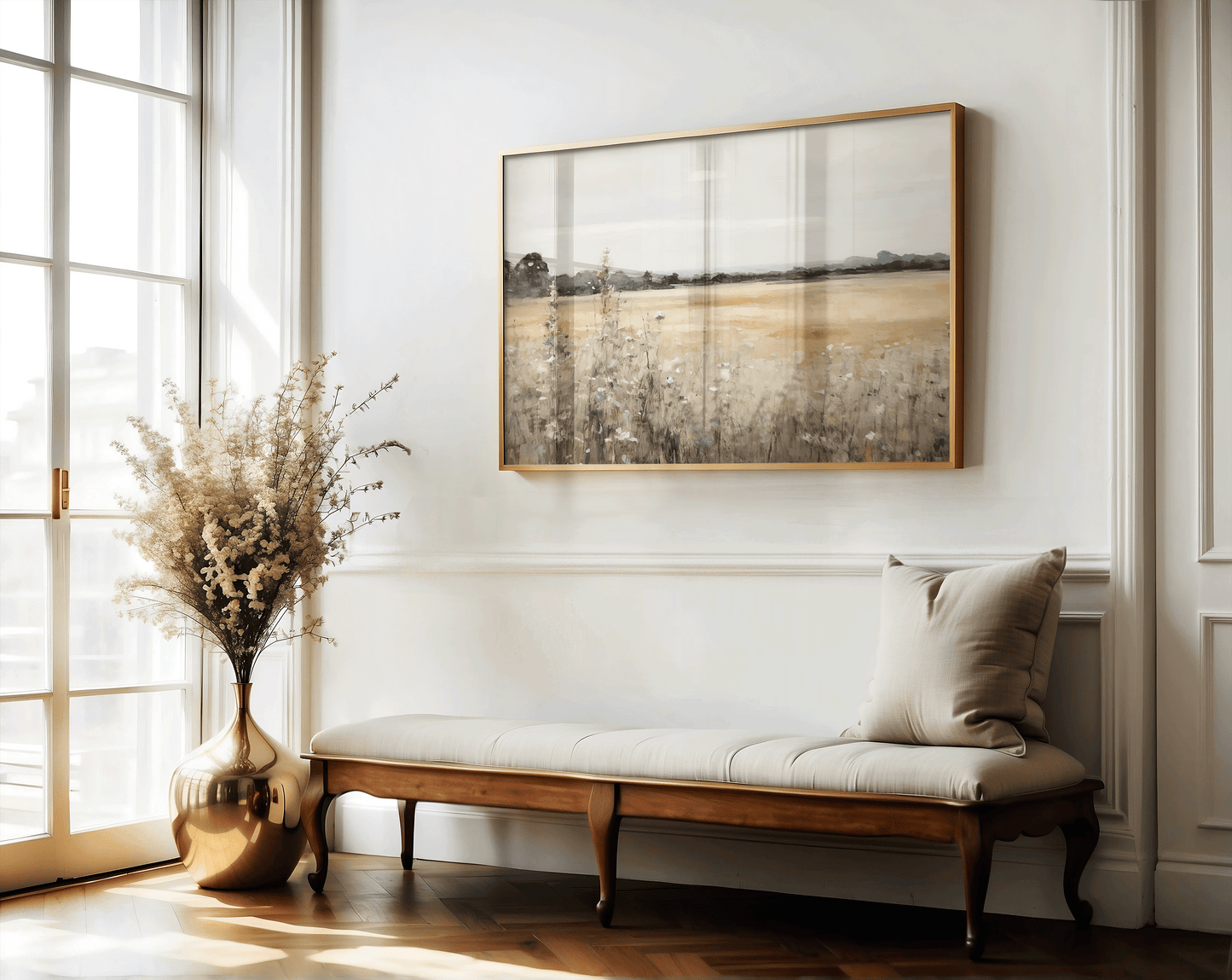 Muted countryside landscape framed wall art with golden fields, styled above a hallway bench with soft natural light. Rustic farmhouse entryway decor.