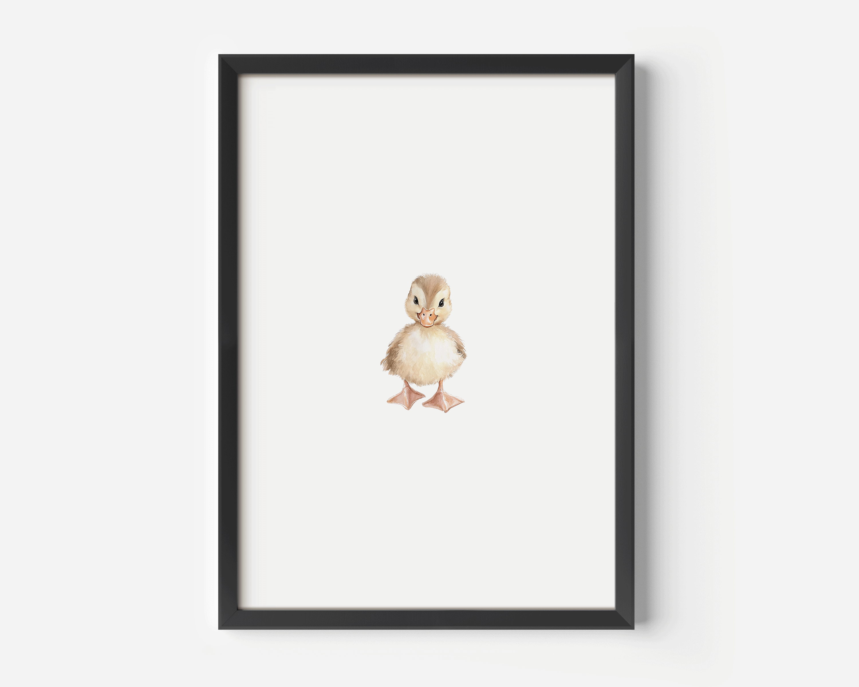 Framed woodland nursery wall art in black wood frame displayed on a white wall