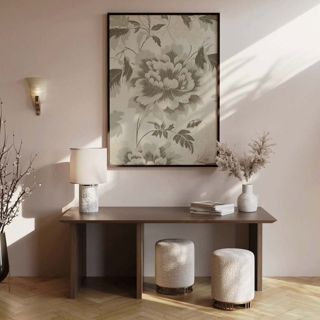 Modern interior with a wooden console table, green and beige vintage floral canvas wall art, and decorative accent pieces.