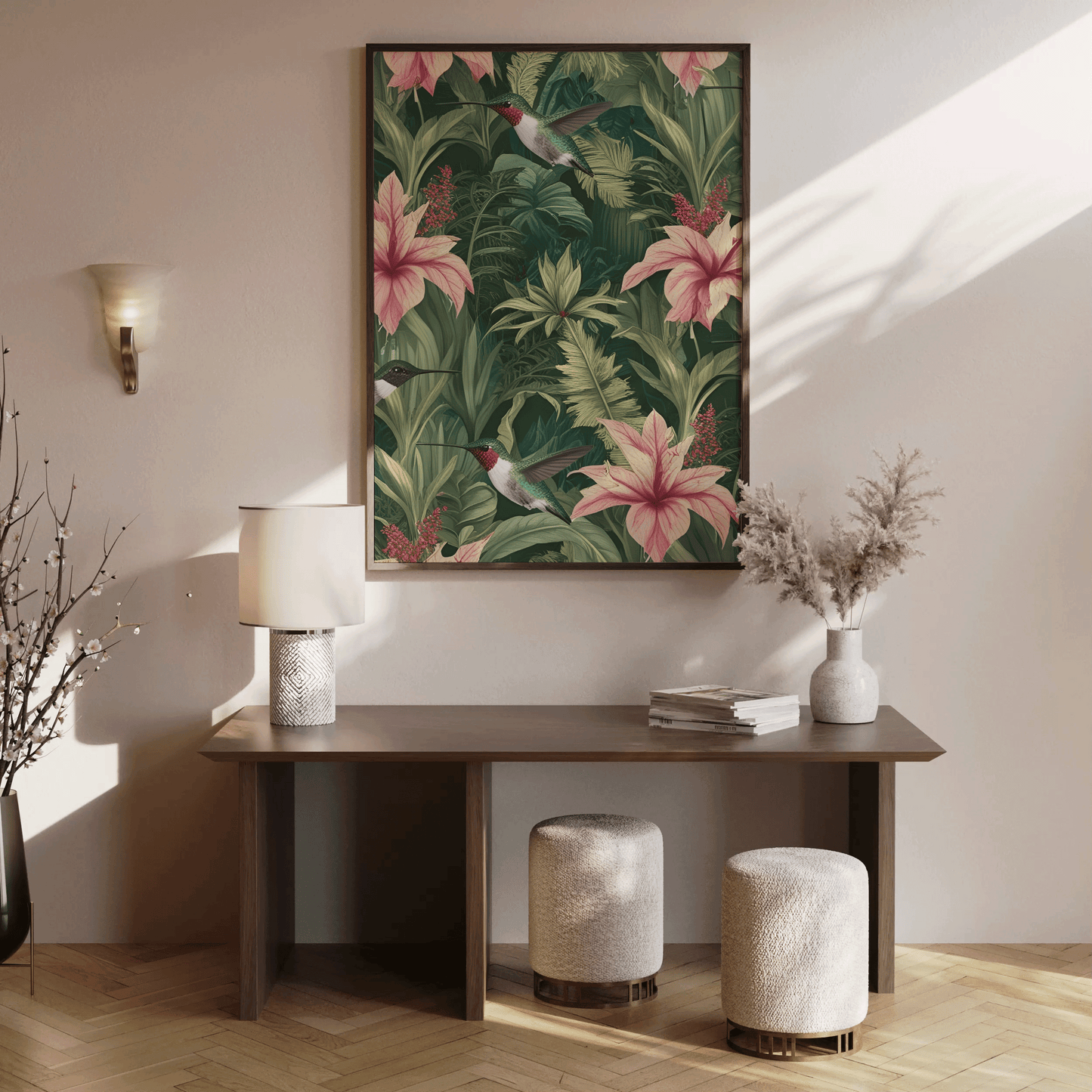 Hummingbird botanical wall art with pink florals and lush forest greenery styled in a hallway or entryway room setting over a wooden console table.