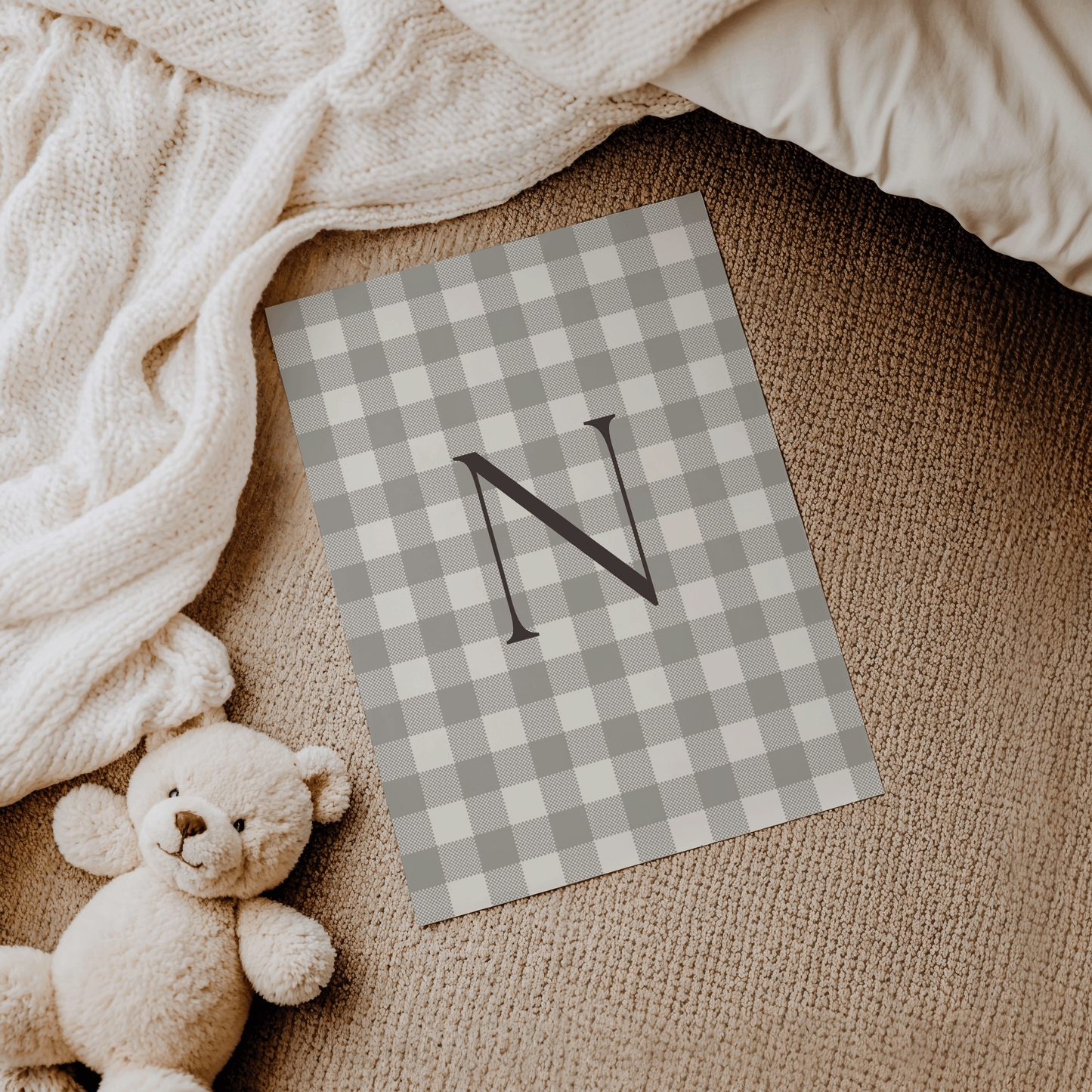 Beige and cream monogram print N with dark grey letter, styled for modern nursery decor