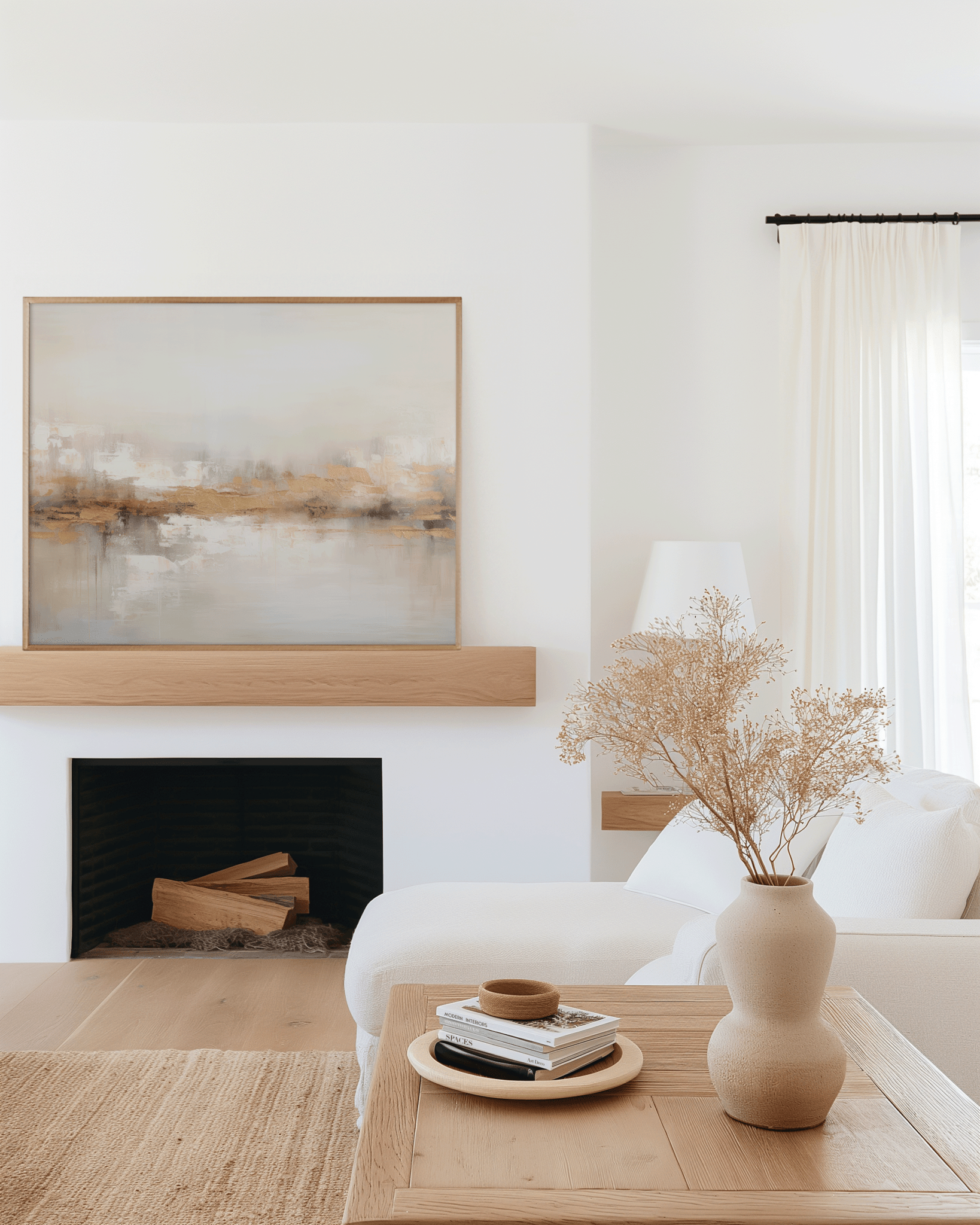 Neutral gold abstract wall art framed canvas styled above modern fireplace with beige sofa and natural decor