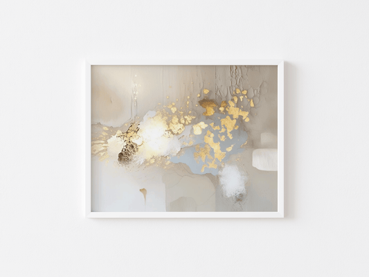 White-framed abstract artwork with gold metallic, beige, taupe and white elements on a white background.