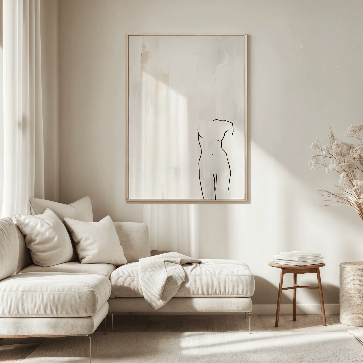 Large neutral line figure wall art framed in beige wood hanging above a cream sectional sofa in a bright minimalist living room with natural light and soft textiles