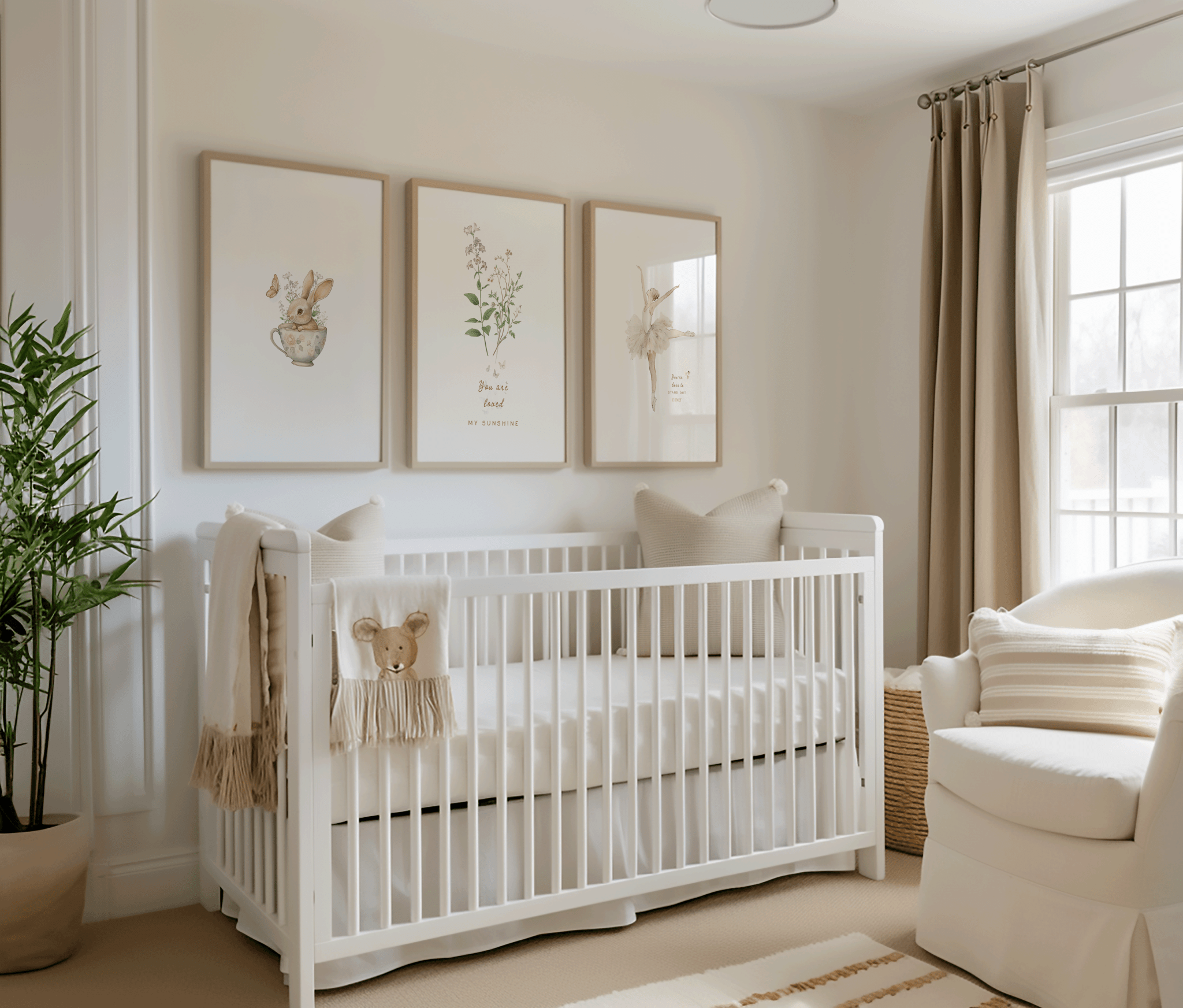 set of 3 framed vintage nursery wall art prints above a white crib in a neutral, minimal nursery for a little girl. the artwork features a sweet vintage baby bunny rabbit in a muted green teacup, wildflowers with quote "you are loved my sunshine", and a vintage beige ballerina in a tutu and the quote "you're born to stand out honey".