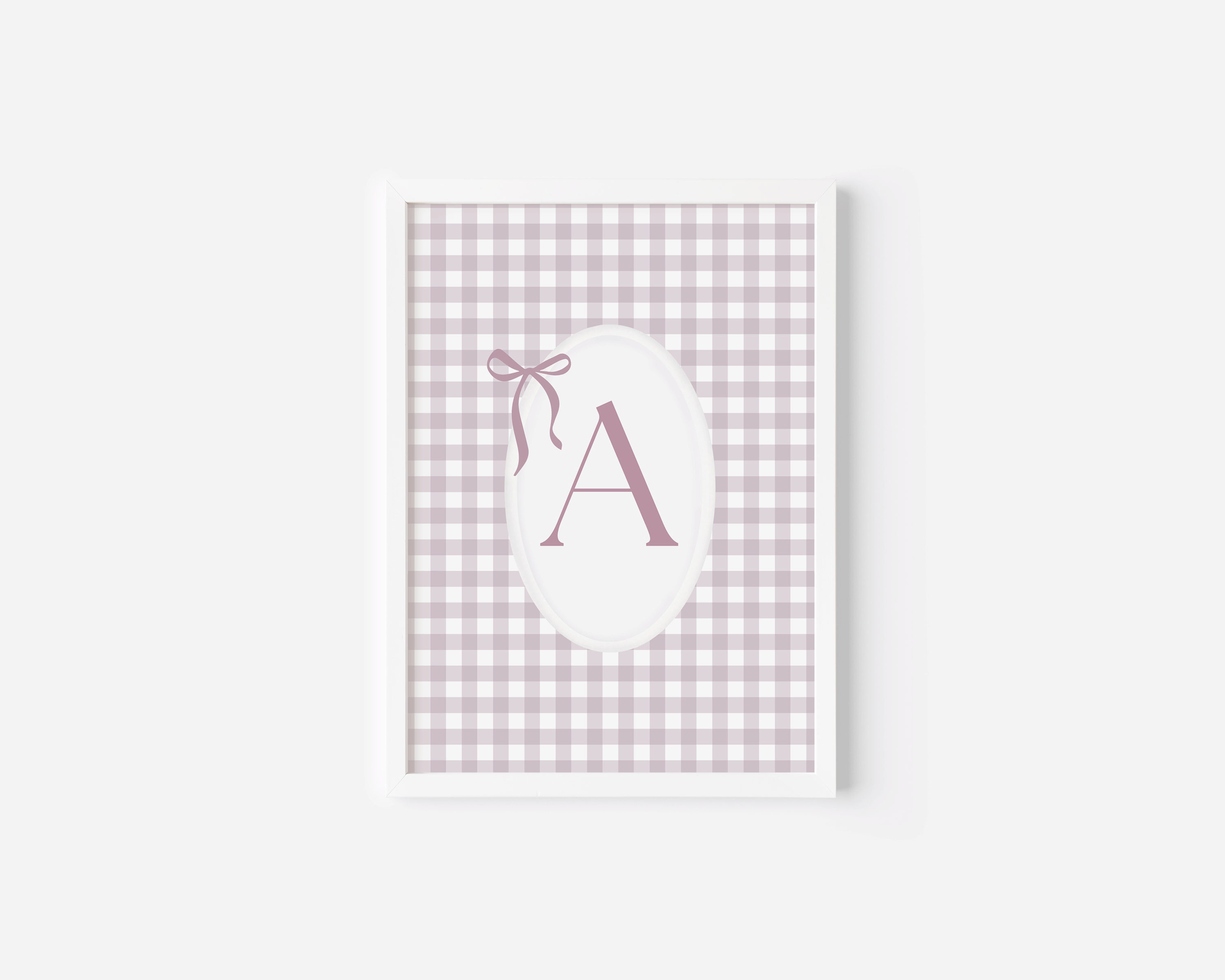 Custom pink monogram wall art with initial A and bow on gingham background for nursery