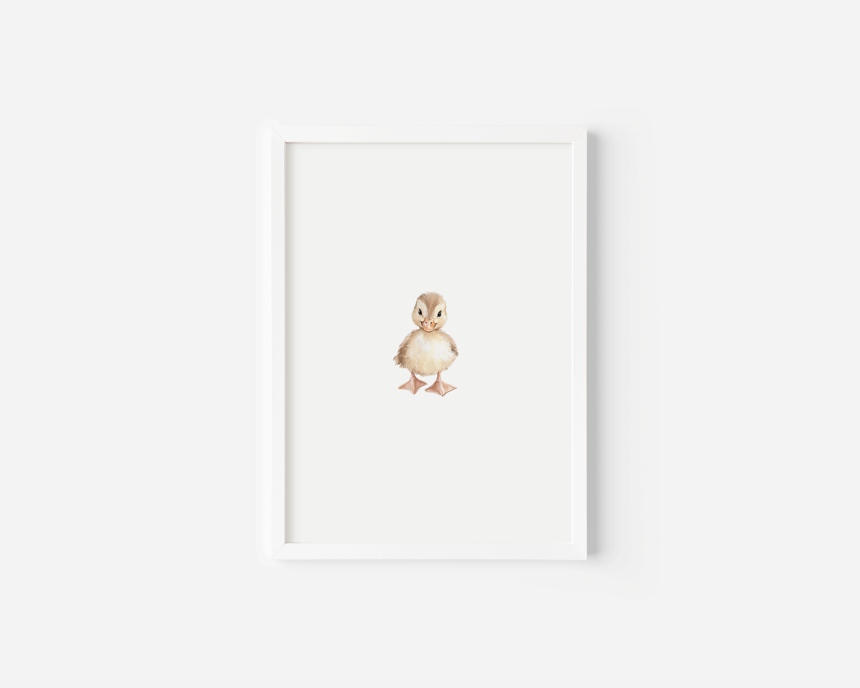 Framed woodland nursery wall art in white wood frame displayed on a white wall
