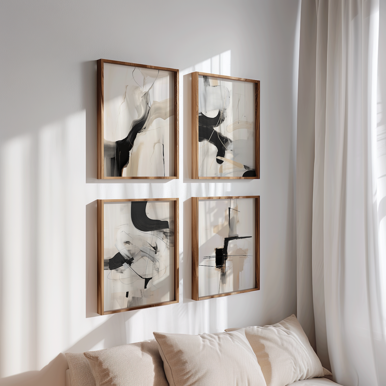 Set of 4 minimalist black and white abstract wall art prints in wooden frames, styled above a neutral sofa with natural light. Modern abstract wall decor for living rooms, bedrooms, or contemporary home interiors.