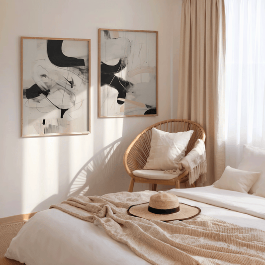 Canvas wall art for bedroom featuring two framed black and beige abstract minimal 18x24 prints above a neutral boho bed