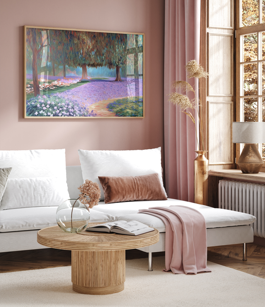 Framed colorful abstract landscape wall art featuring trees, flowers, and a lavender path, styled in a modern living room with blush walls. Nature-inspired wall décor that blends vibrant tones with contemporary home design.