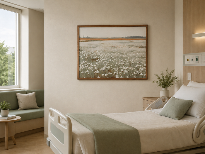 Framed nature landscape wall art hanging in a calming hospital patient room with soft neutral and green tones