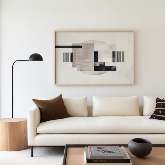 Modern living room with canvas wall art hanging above a beige couch, styled with neutral decor