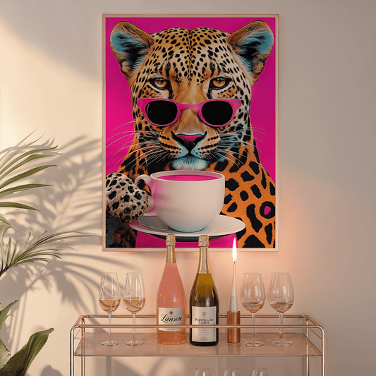 Funky wall art featuring a colorful leopard wearing sunglasses on a hot pink background, styled above a console table with plants and wine bottles — modern, bold, and playful home decor.