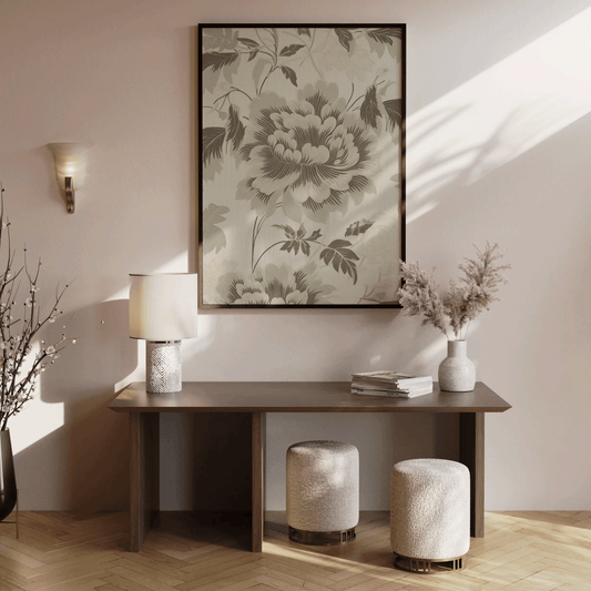 muted green floral wall art framed above a brown wooden console table in hallway showing proper placement of art in hallway
