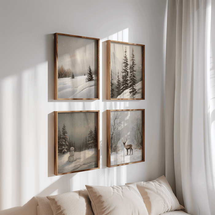 Four framed neutral winter landscape prints in a 2x2 grid above a beige sofa