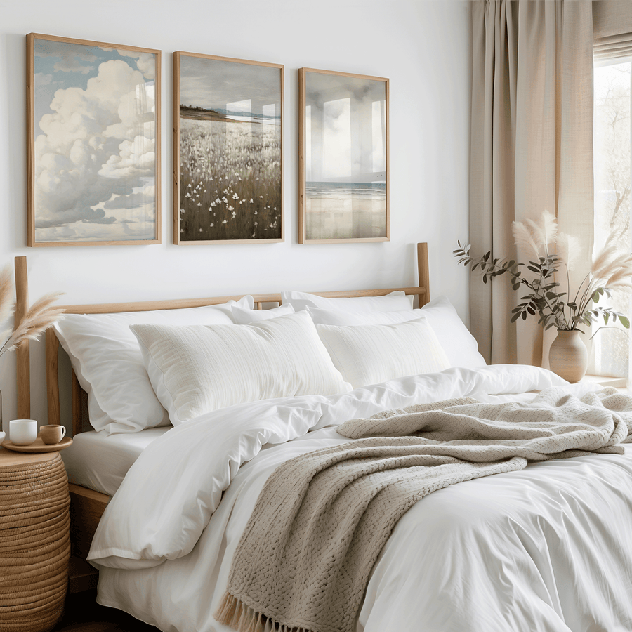 Neutral bedroom with framed wall art above the bed, featuring three coordinated prints hung evenly to demonstrate proper wall art spacing and placement.