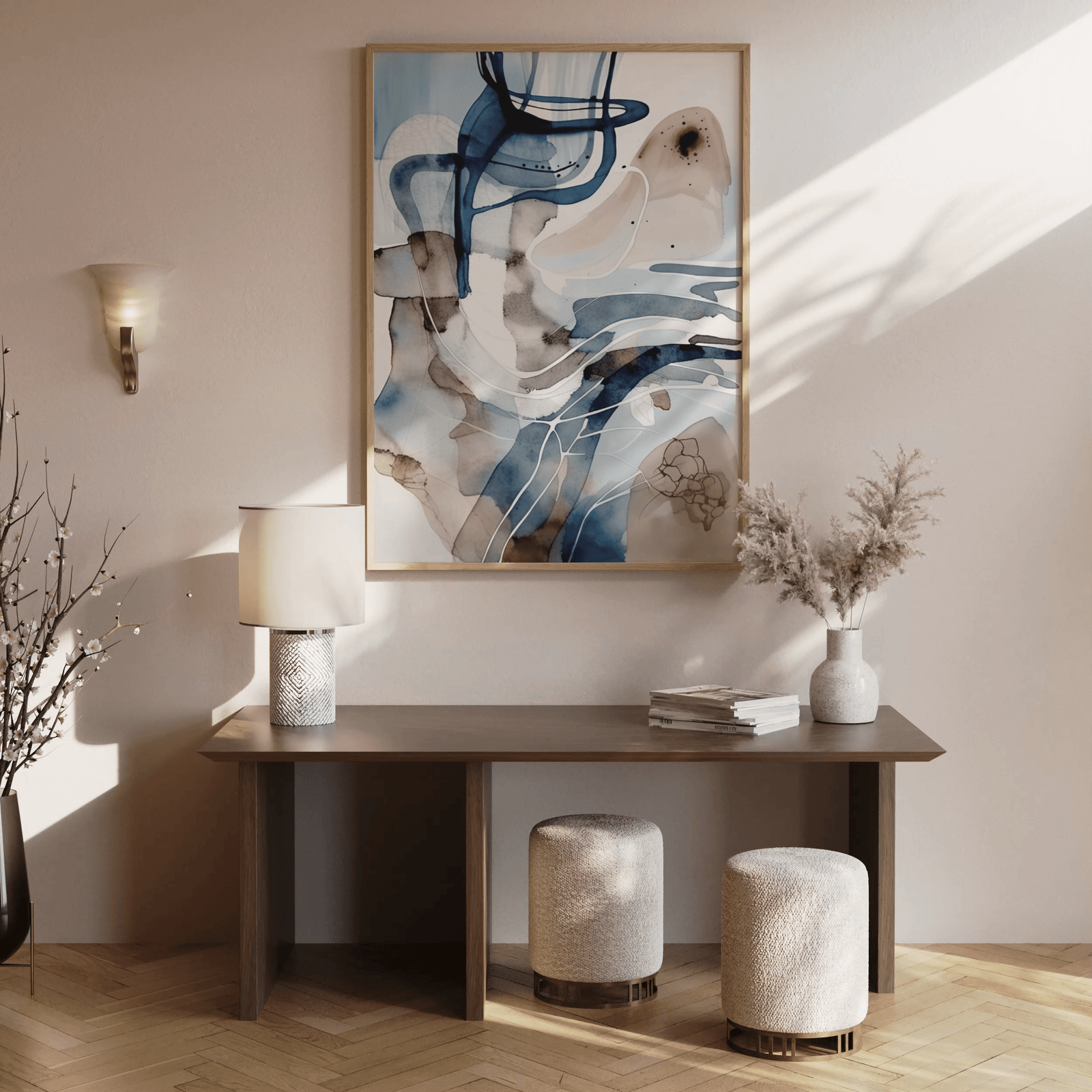 Abstract blue, white and beige watercolor wall art framed print styled above a brown wooden entryway console table with neutral décor
