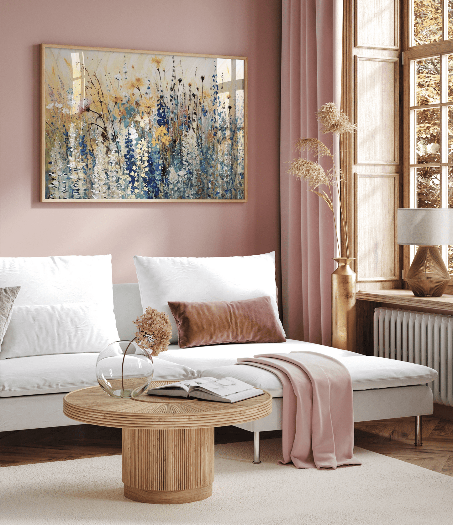 Living room with a white sofa, wooden coffee table, and wildflower abstract framed wall art on a pink wall.