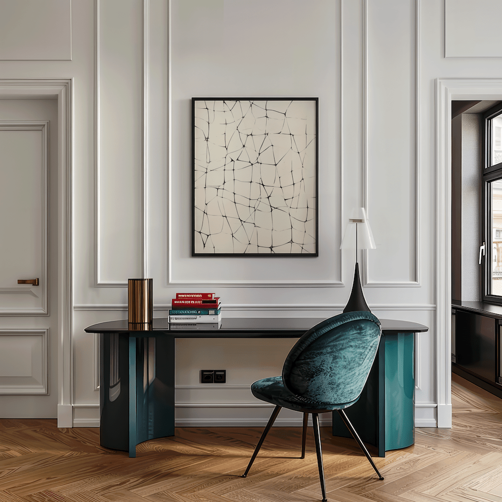 Abstract line grid wall art in black on beige framed in black above a sleek desk with teal chair in a modern home office with wall paneling