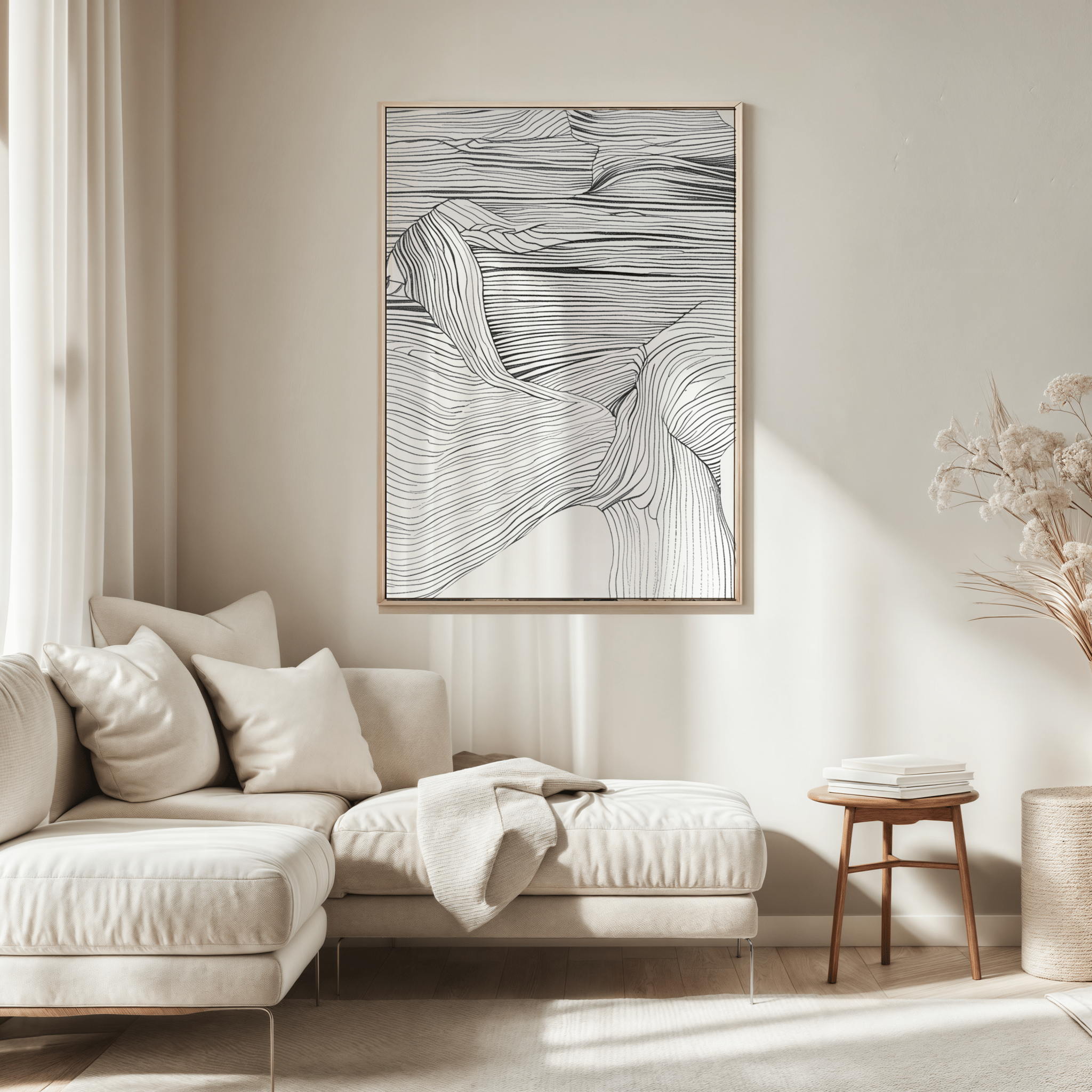 Modern living room with a white sectional sofa, framed minimal abstract wall art with black and white curved lines, and a small wooden table.