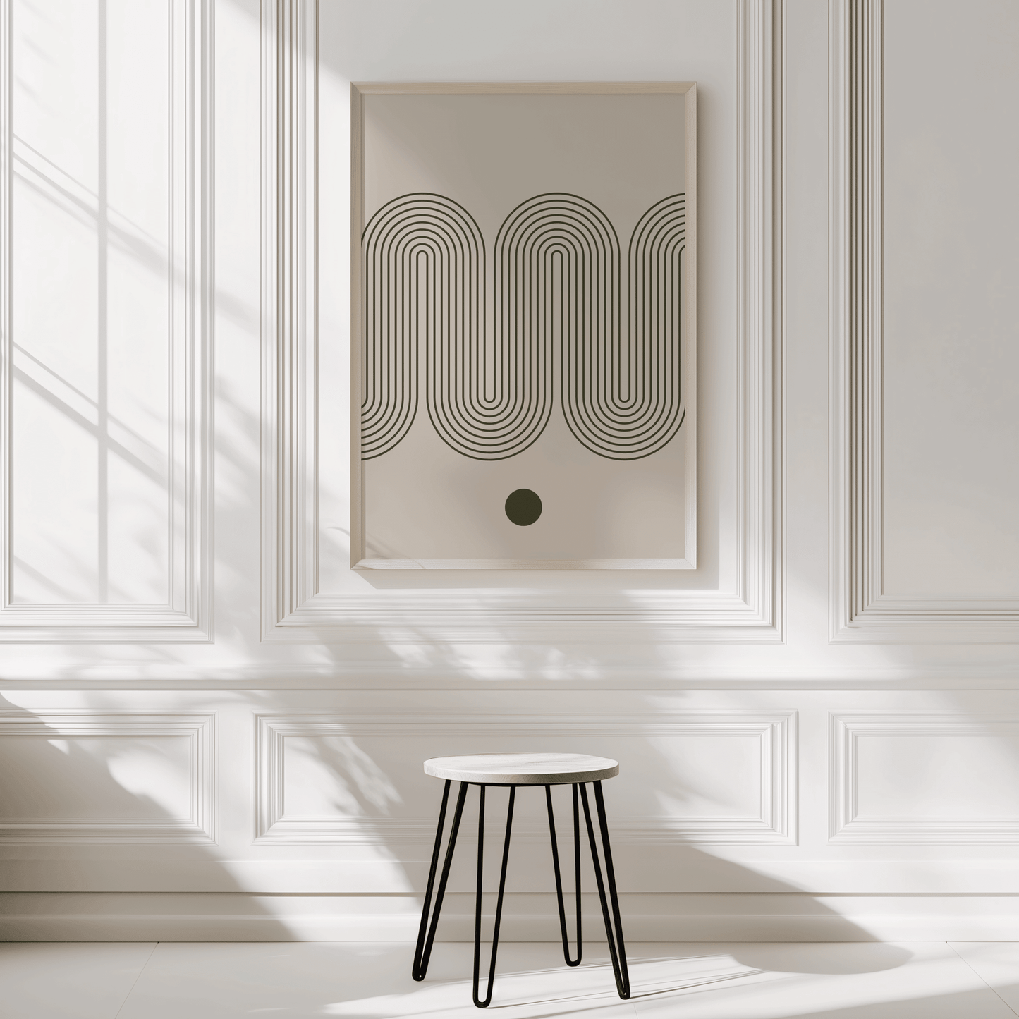 Abstract wave wall art print in a natural wood frame on a panelled entryway wall with a wooden stool