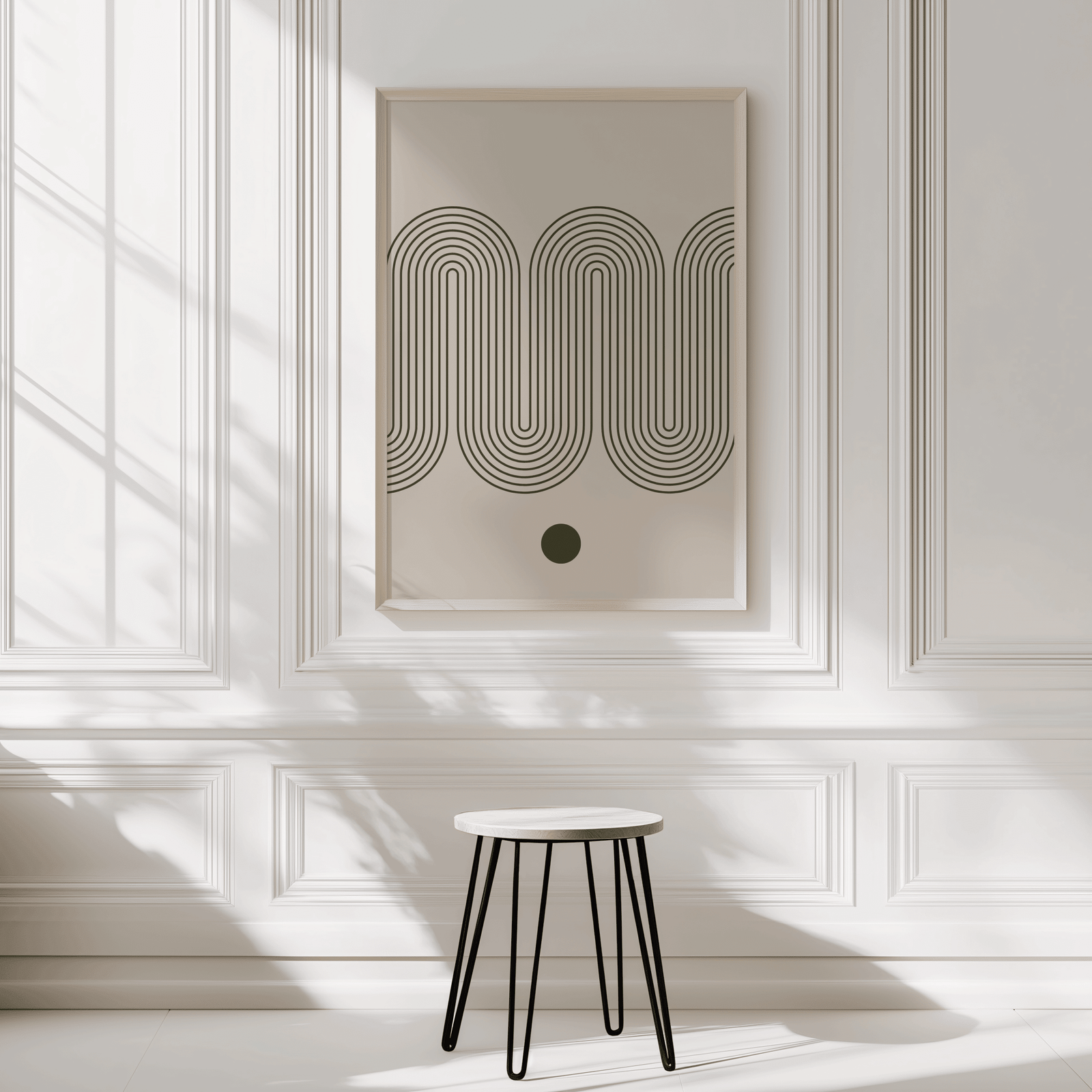 Abstract wave wall art print in a natural wood frame on a panelled entryway wall with a wooden stool