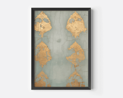 Black-framed artwork with gold leaf patterns on a textured blue grey background