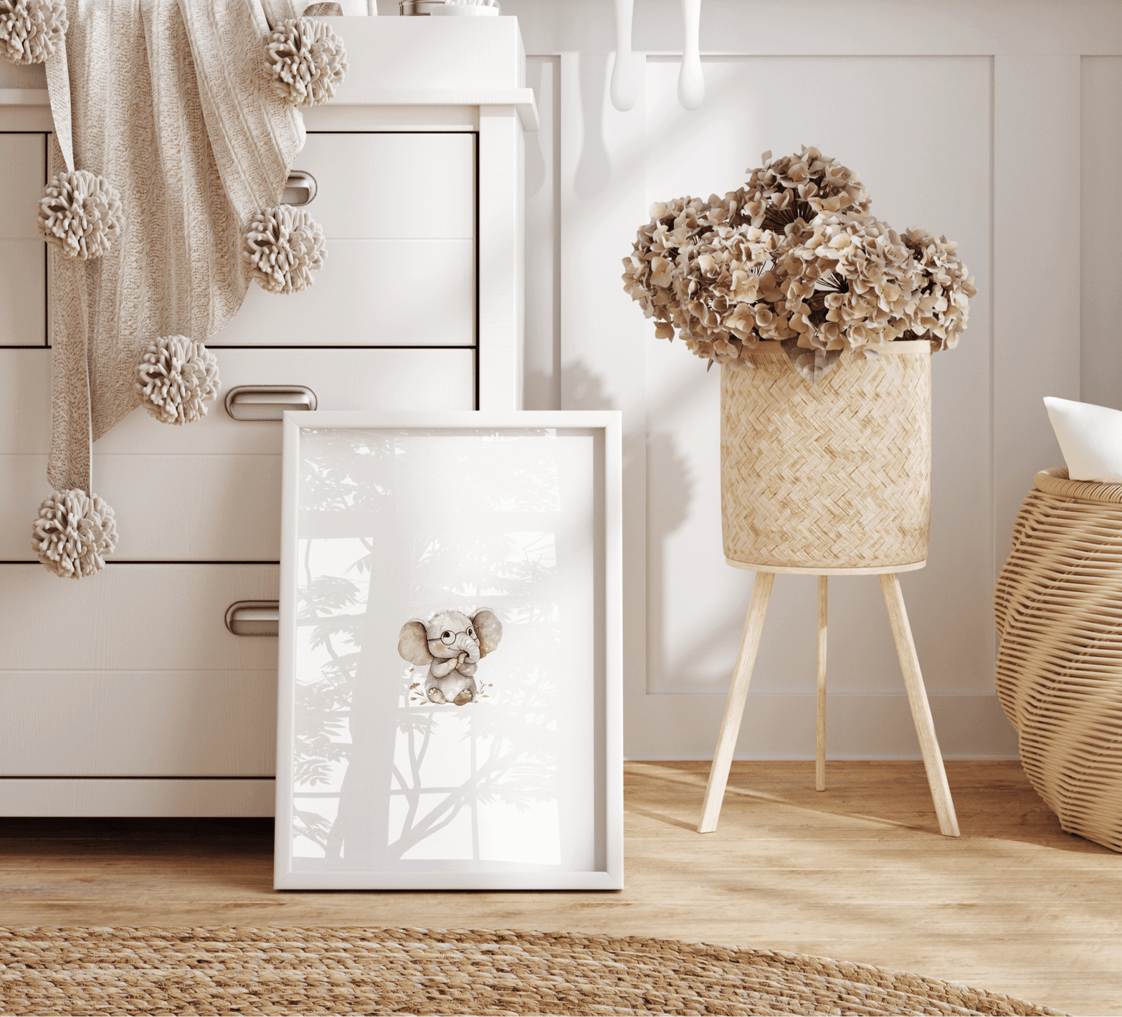 Neutral watercolor elephant print leaning against dresser beside woven basket and dried hydrangeas in a neutral, boho, vintage nursery for little girl