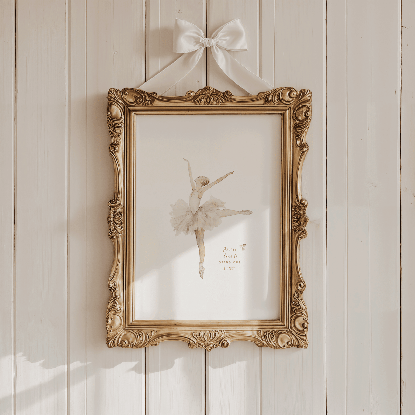 antique style beige Ballerina print in an ornate gold frame with ribbon bow; vintage girl nursery wall art in soft neutrals.