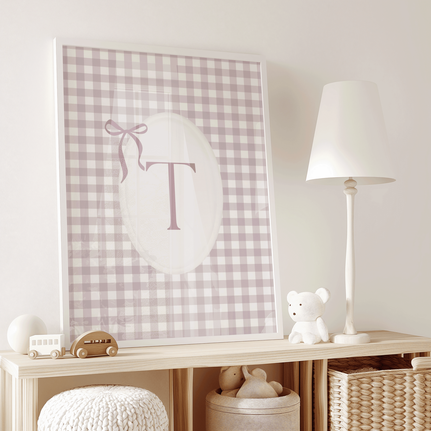 Pink gingham personalized initial wall art with letter T and blush pink ribbon bow with a white frame for modern nursery or play room styling