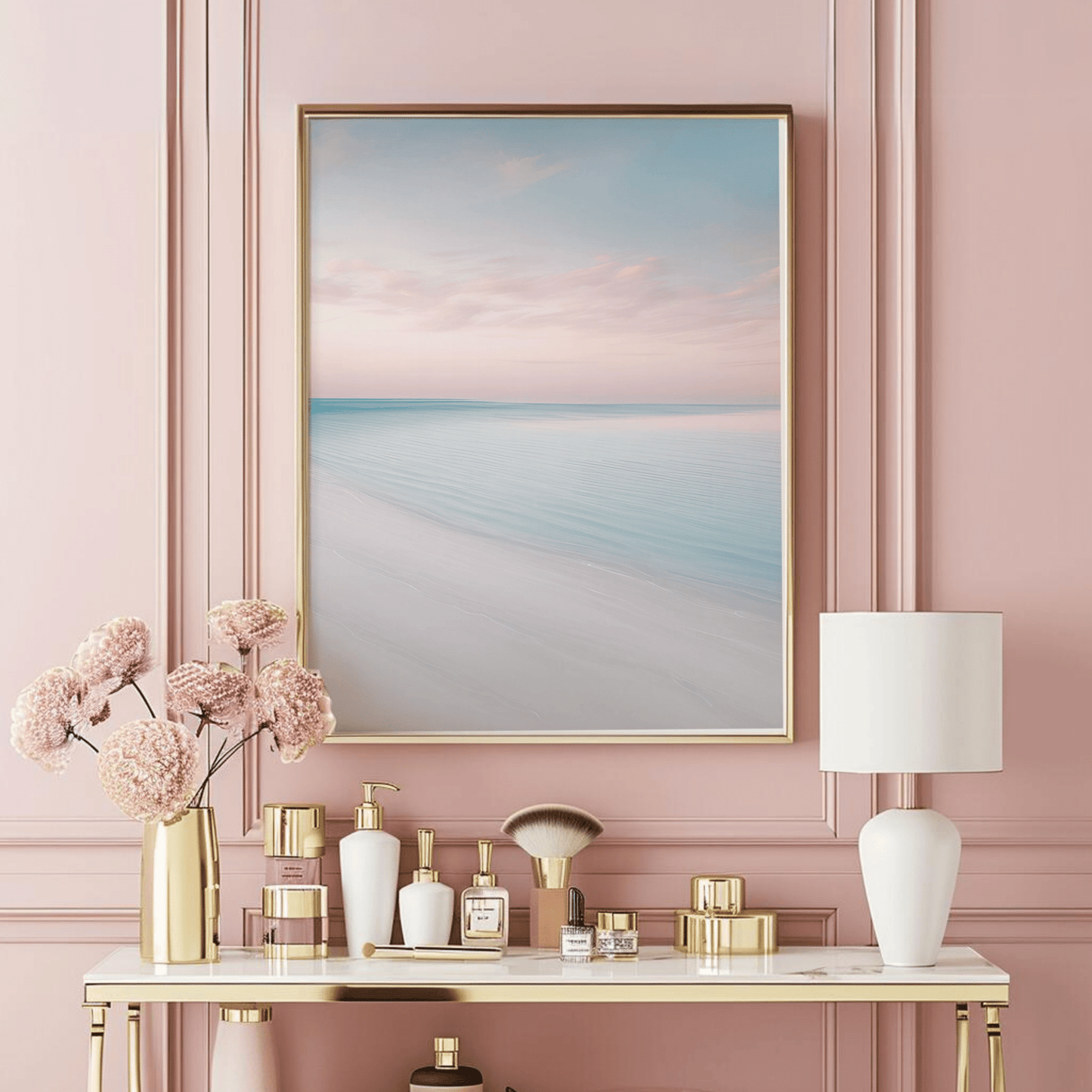 Framed canvas beach wall art displayed above a pink vanity table
