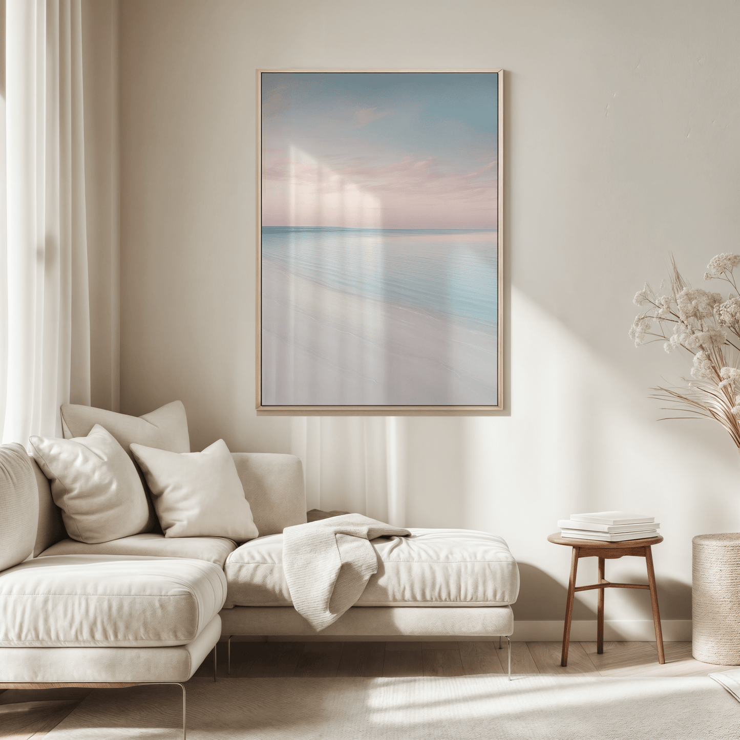 Natural framed beach wall art above a beige sofa in a living room