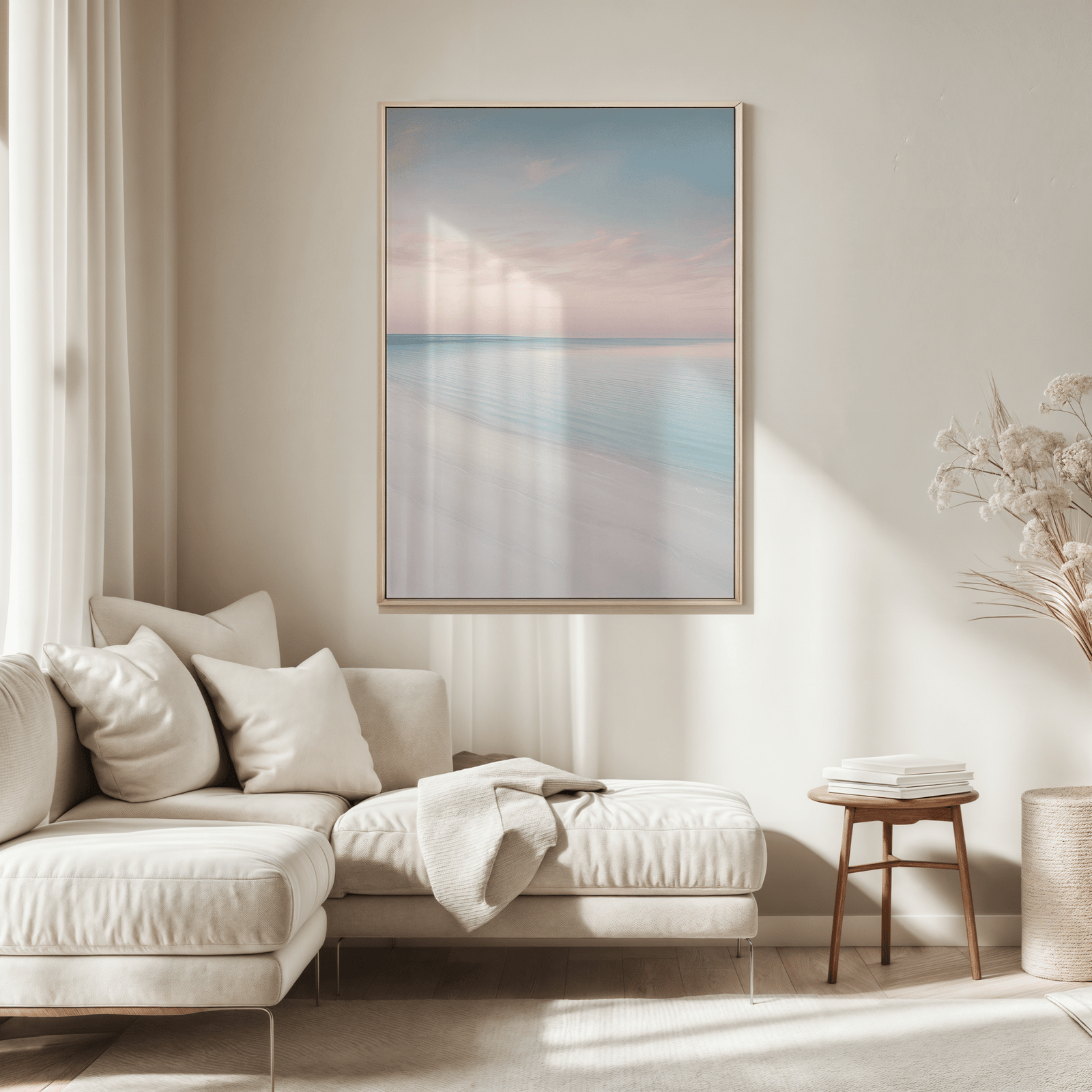 Natural framed beach wall art above a beige sofa in a living room