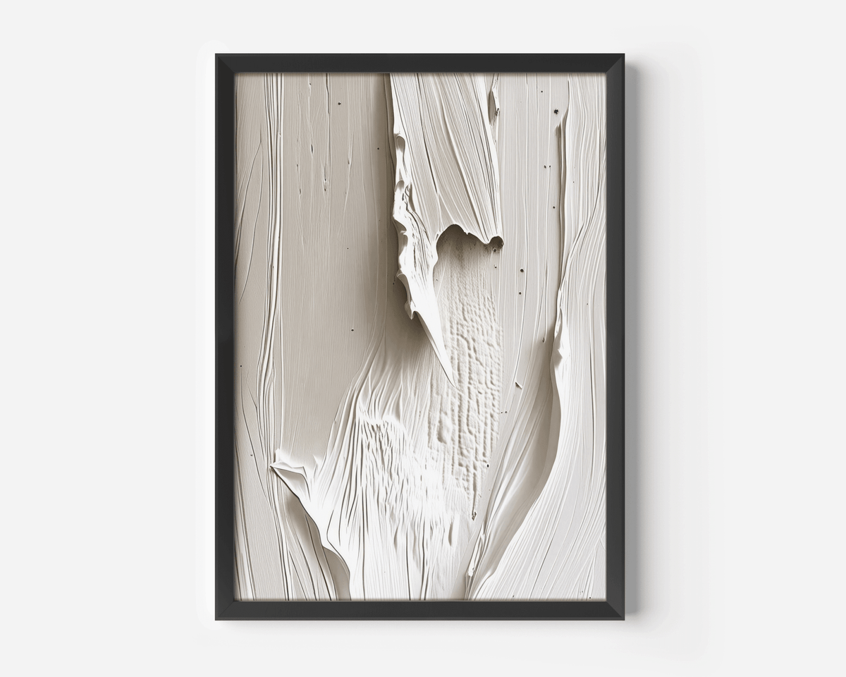Black-framed wall art featuring faux-texture with paint-like brushstrokes - a mix of beige, cream and white tones. Abstract wall art on a white wall.