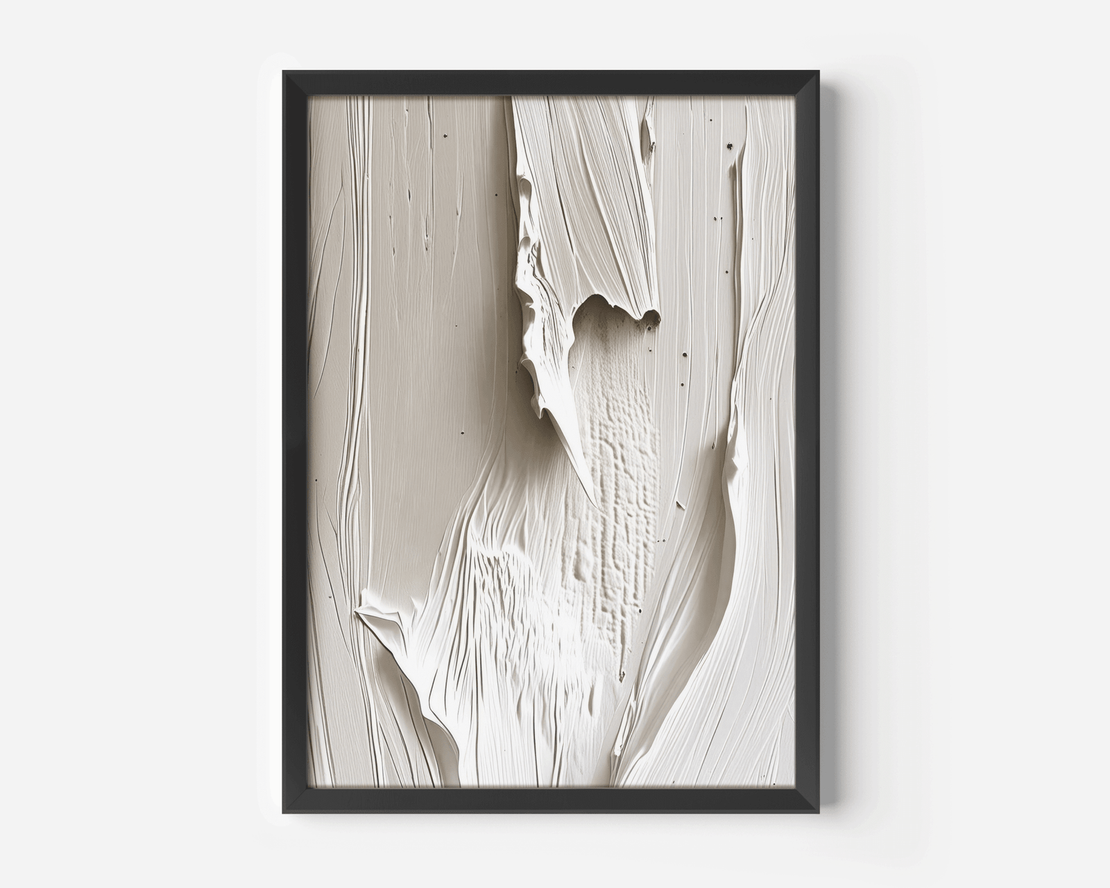 Black-framed wall art featuring faux-texture with paint-like brushstrokes - a mix of beige, cream and white tones. Abstract wall art on a white wall.