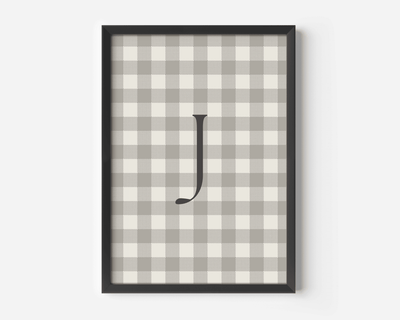 close-up of personalized beige gingham wall art with letter J, black matte frame modern nursery print for boys