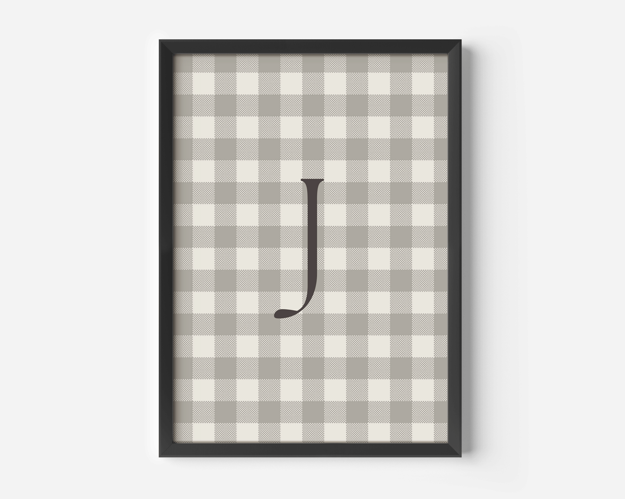 close-up of personalized beige gingham wall art with letter J, black matte frame modern nursery print for boys