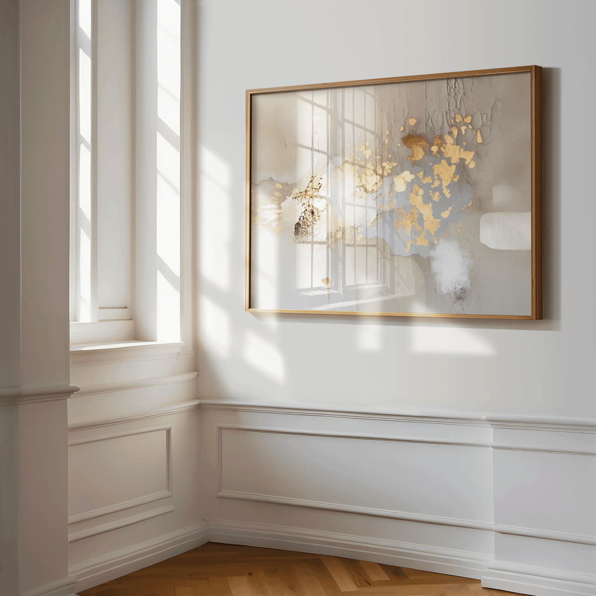 Modern metallic gold, beige, and grey abstract wall art print featuring metallic accents and soft neutral tones. A natural wood framed canvas print in a hallway with natural light.