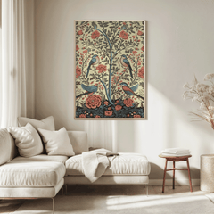 Bird and rose print in a natural frame above a cream sofa in a sunlit neutral living room