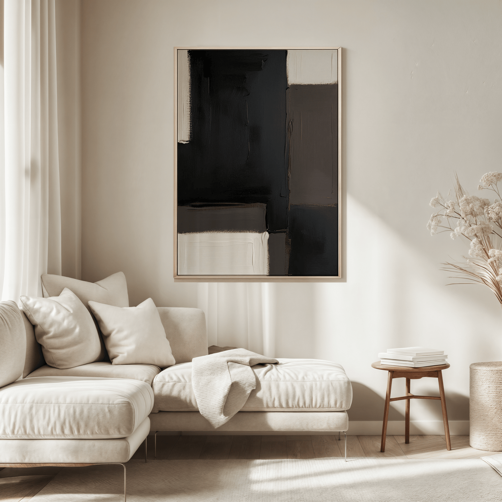 Black and Brown Abstract Wall Art – Neutral Modern Canvas Print, featuring rich black, earthy tones, and neutral shades framed in a light wood frame over a cream sectional in a minimal living room
