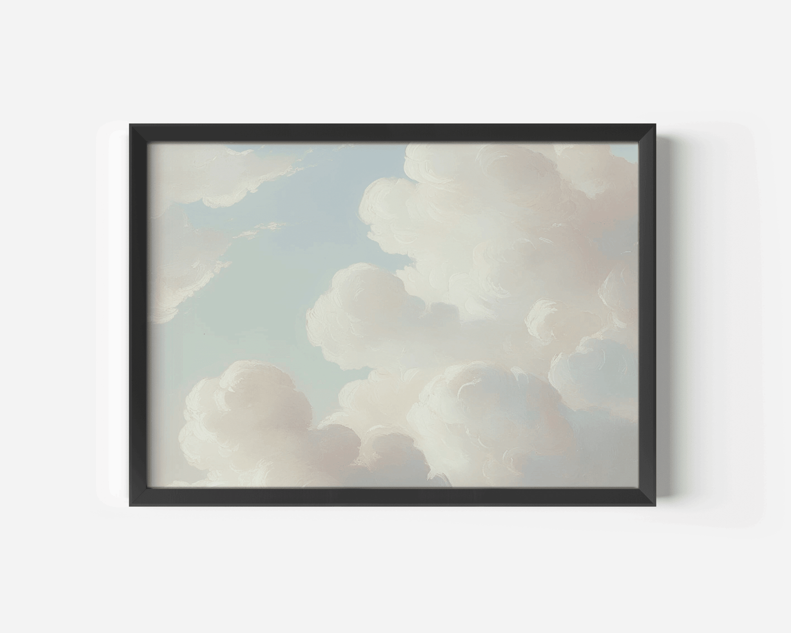 Framed cloud canvas print on white wall with black frame