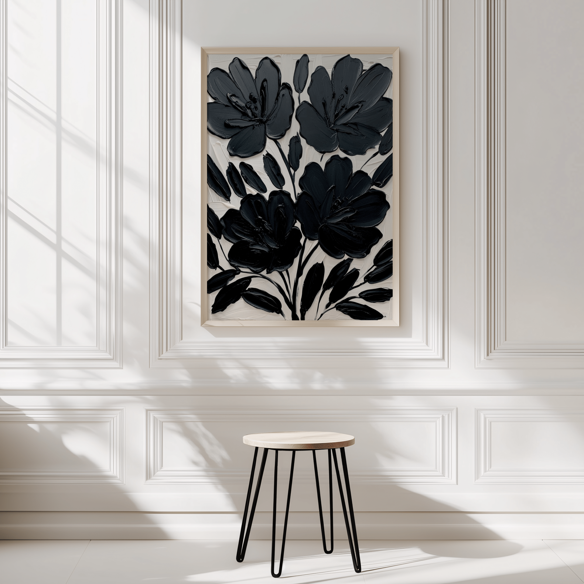 Black floral abstract wall art framed canvas styled on white wall with stool in minimalist decor