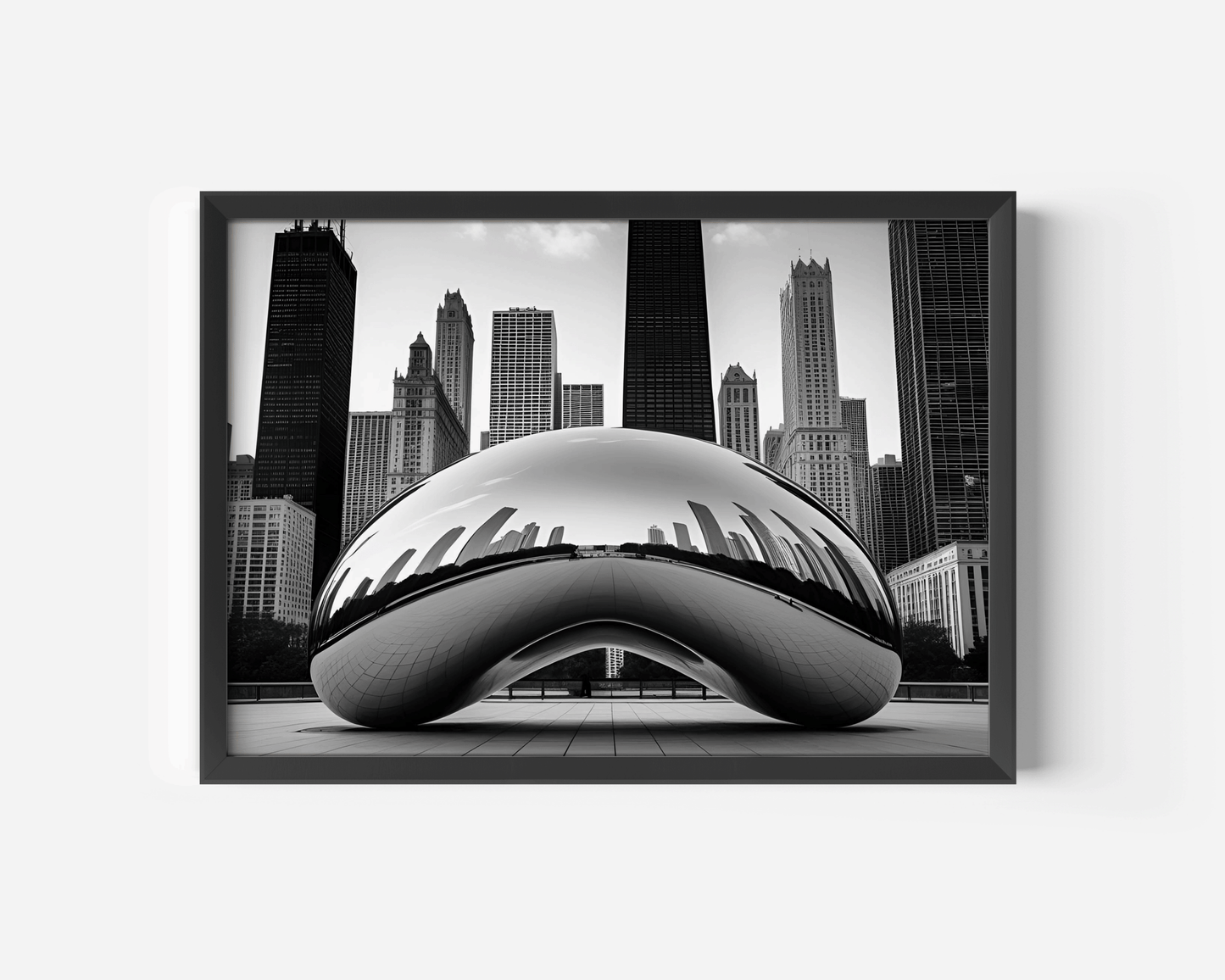 Black and White Chicago Cityscape Featuring the Bean wall art with a black frame against a white wall