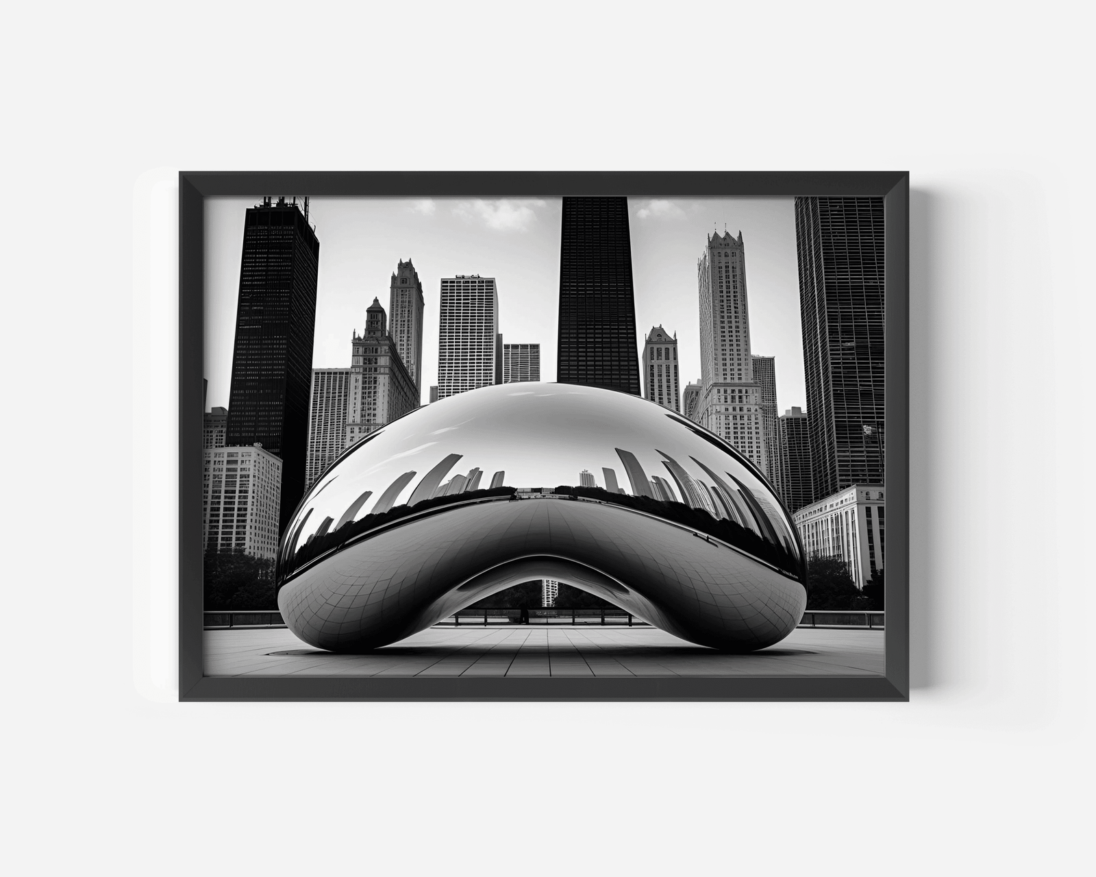 Black and White Chicago Cityscape Featuring the Bean wall art with a black frame against a white wall