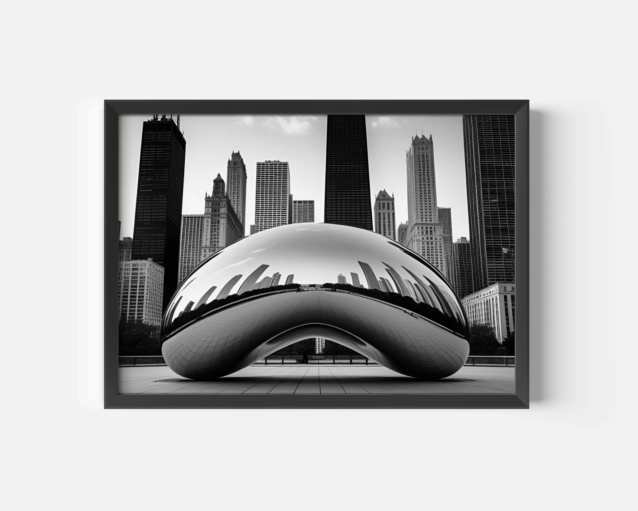 Black and White Chicago Cityscape Featuring the Bean wall art with a black frame against a white wall